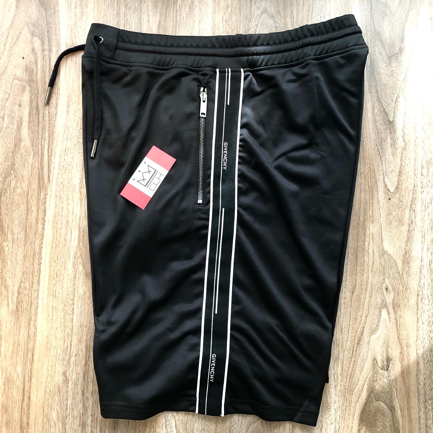 GIVENCHY TICKER LOGO TRACK SHORTS